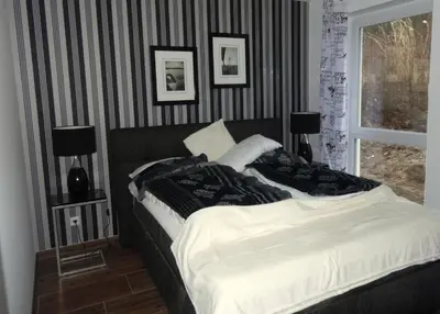 Ein Bett oder Betten in einem Zimmer der Unterkunft Charming Apartments am See