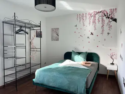 Ein Bett oder Betten in einem Zimmer der Unterkunft Zimmer der Welt