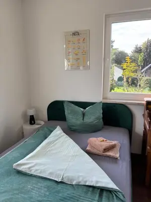 Ein Bett oder Betten in einem Zimmer der Unterkunft Zimmer der Welt