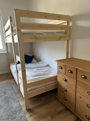Ein Bett oder Betten in einem Zimmer der Unterkunft Modernes Ferienhaus für bis zu 10 Gäste