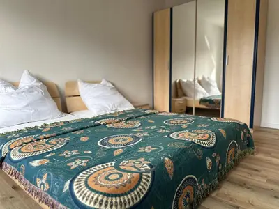 Ein Bett oder Betten in einem Zimmer der Unterkunft Modernes Ferienhaus für bis zu 10 Gäste