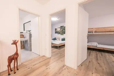 Ein Bett oder Betten in einem Zimmer der Unterkunft Modernes Ferienhaus für bis zu 10 Gäste