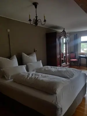 Ein Bett oder Betten in einem Zimmer der Unterkunft Schuberts Oderbruch Landpension