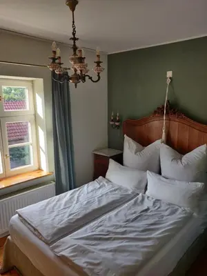 Ein Bett oder Betten in einem Zimmer der Unterkunft Schuberts Oderbruch Landpension