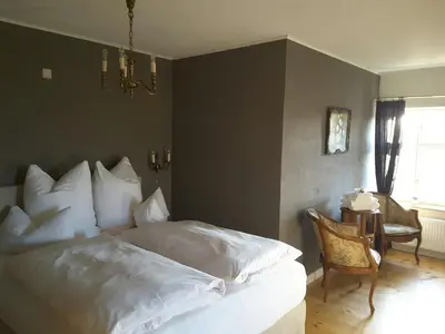 Ein Bett oder Betten in einem Zimmer der Unterkunft Schuberts Oderbruch Landpension
