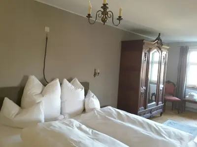 Ein Bett oder Betten in einem Zimmer der Unterkunft Schuberts Oderbruch Landpension