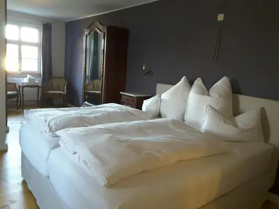 Ein Bett oder Betten in einem Zimmer der Unterkunft Schuberts Oderbruch Landpension