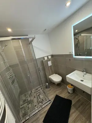 Ein Badezimmer in der Unterkunft Pension am Helios