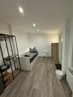 Ein Bett oder Betten in einem Zimmer der Unterkunft Pension am Helios