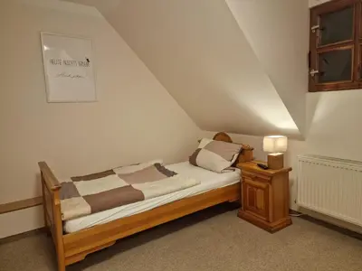 Ein Bett oder Betten in einem Zimmer der Unterkunft Gasthaus Fontane GmbH