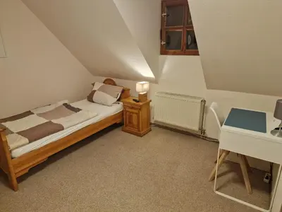 Ein Bett oder Betten in einem Zimmer der Unterkunft Gasthaus Fontane GmbH