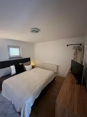 Ein Bett oder Betten in einem Zimmer der Unterkunft HappyNest