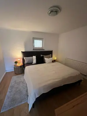 Ein Bett oder Betten in einem Zimmer der Unterkunft HappyNest
