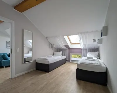 Ein Bett oder Betten in einem Zimmer der Unterkunft 3 Bedroom-Apartment with 1,5 Bathrooms