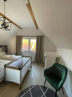 Ein Bett oder Betten in einem Zimmer der Unterkunft 3 Bedroom-Apartment with 1,5 Bathrooms