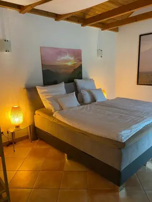 Ein Bett oder Betten in einem Zimmer der Unterkunft Ferienhaus am Feld nahe Berlin