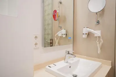 Ein Badezimmer in der Unterkunft Homaris West Side - Self-Check In