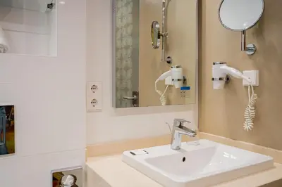 Ein Badezimmer in der Unterkunft Homaris West Side - Self-Check In
