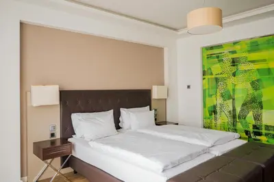 Ein Bett oder Betten in einem Zimmer der Unterkunft Homaris West Side - Self-Check In