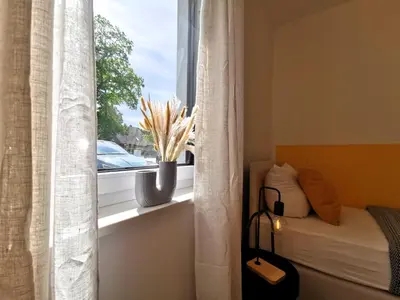 Ein Bett oder Betten in einem Zimmer der Unterkunft BohnApartments Franzstraße - kostenlose Parkplätze - sehr ruhig - Neubau - Vollausstattung - WLAN