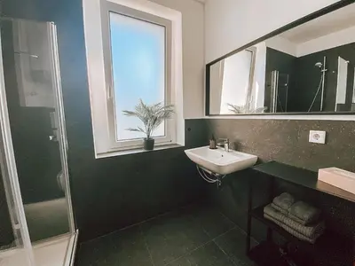 Ein Badezimmer in der Unterkunft BetterBeds City - Apartments - Zentral - Smart TV - Küche - WLAN