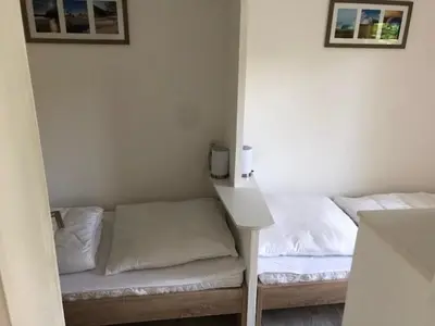 Ein Bett oder Betten in einem Zimmer der Unterkunft Ferienhäuser am Heidesee
