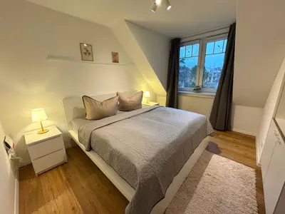 Ein Bett oder Betten in einem Zimmer der Unterkunft K14 FeWo - Am Kurpark - Therme