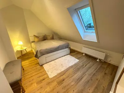 Ein Bett oder Betten in einem Zimmer der Unterkunft K14 FeWo - Am Kurpark - Therme