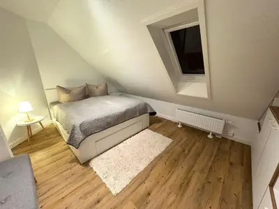 Ein Bett oder Betten in einem Zimmer der Unterkunft K14 FeWo - Am Kurpark - Therme