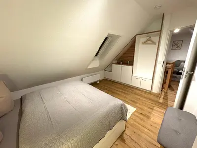 Ein Bett oder Betten in einem Zimmer der Unterkunft K14 FeWo - Am Kurpark - Therme