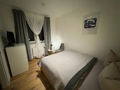 Ein Bett oder Betten in einem Zimmer der Unterkunft S4 FeWo in Bad Saarow, Seestr 4a