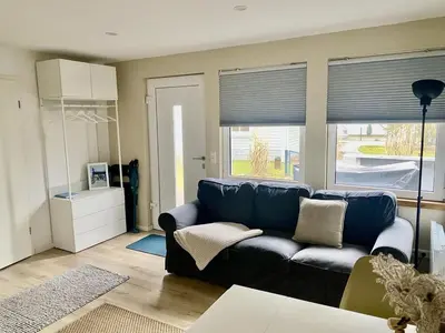 Ein Sitzbereich in der Unterkunft Ferienbungalow Arne am Wald