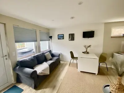 Ein Sitzbereich in der Unterkunft Ferienbungalow Arne am Wald