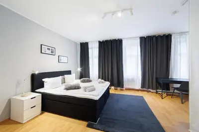 Ein Bett oder Betten in einem Zimmer der Unterkunft Grand Central City Apartments Mitte Museumsinsel
