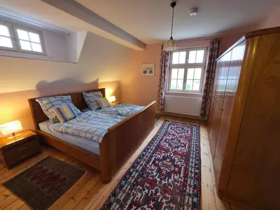Ein Bett oder Betten in einem Zimmer der Unterkunft Gemütliche Wohnungen in Wansdorf im denkmalgeschützten Haus