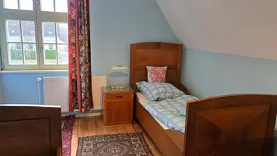 Ein Bett oder Betten in einem Zimmer der Unterkunft Gemütliche Wohnungen in Wansdorf im denkmalgeschützten Haus