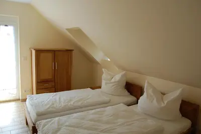 Ein Bett oder Betten in einem Zimmer der Unterkunft Ferienwohnung am Mühlstein