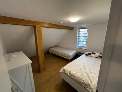 Ein Bett oder Betten in einem Zimmer der Unterkunft Ferienwohnung in Seelow nähe polnische Grenze