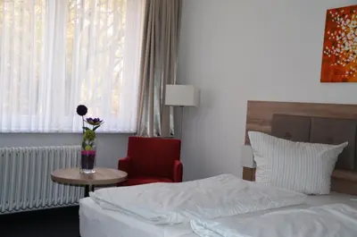 Ein Bett oder Betten in einem Zimmer der Unterkunft Gästehaus Pauline