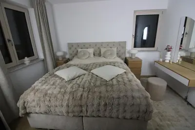 Ein Bett oder Betten in einem Zimmer der Unterkunft Haus am See