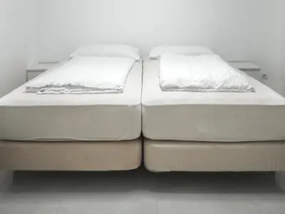 Ein Bett oder Betten in einem Zimmer der Unterkunft Apartments Issa