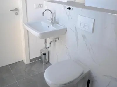 Ein Badezimmer in der Unterkunft Apartments Issa