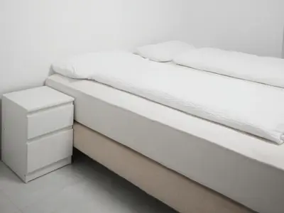 Ein Bett oder Betten in einem Zimmer der Unterkunft Apartments Issa