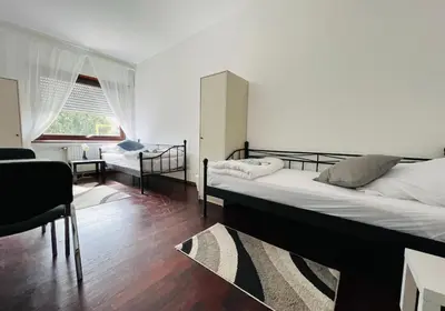 Ein Bett oder Betten in einem Zimmer der Unterkunft GPZ Monteurzimmer Unterkunft Möbliertes Zimmer Pension