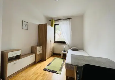 Ein Bett oder Betten in einem Zimmer der Unterkunft GPZ Monteurzimmer Unterkunft Möbliertes Zimmer Pension