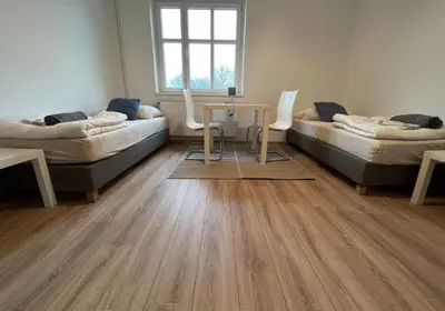 Ein Bett oder Betten in einem Zimmer der Unterkunft GPZ Monteurzimmer Unterkunft Möbliertes Zimmer Pension