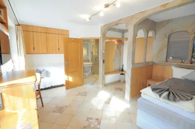 Ein Bett oder Betten in einem Zimmer der Unterkunft Hotel Blumenbach
