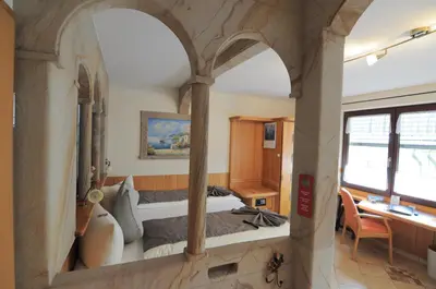 Ein Bett oder Betten in einem Zimmer der Unterkunft Hotel Blumenbach