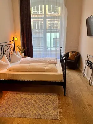 Ein Bett oder Betten in einem Zimmer der Unterkunft cinderella.kreuzberg