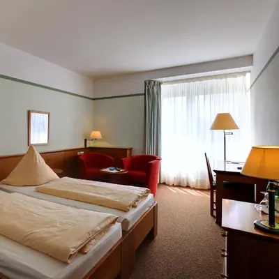 Ein Bett oder Betten in einem Zimmer der Unterkunft Landsitz Hotel Templin